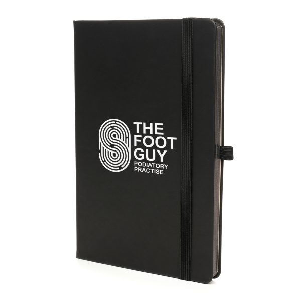 This notebook comes with a Recycled PU outer cover and durable 950gsm recycled cardboard inner cover. Inside, you'll find 80 perforated sheets of 100gsm cream recycled paper with gun metal edging for a premium look. The notebook is equipped with back pocket, polyester double bookmark ribbons, elastic band closure and a pen loop with gun metal stud. 10p from every notebook sold is donated to ‘Helping Uganda Schools Charity’.