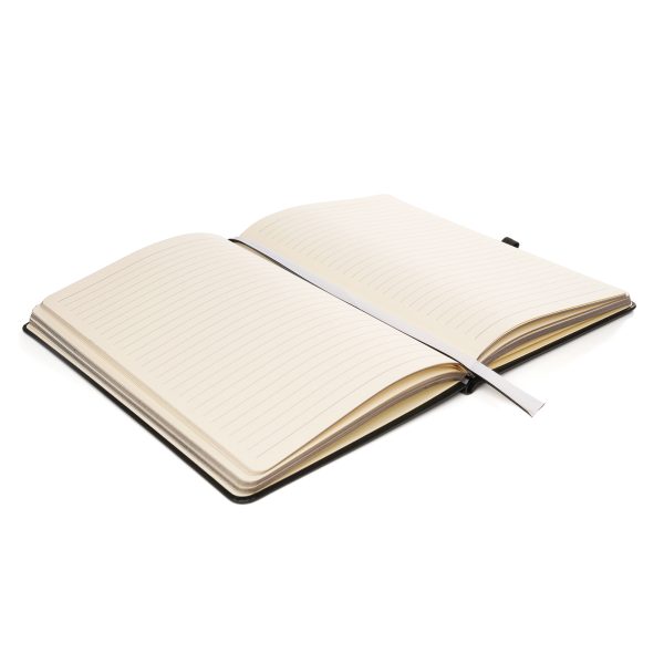 This notebook comes with a Recycled PU outer cover and durable 950gsm recycled cardboard inner cover. Inside, you'll find 80 perforated sheets of 100gsm cream recycled paper with gun metal edging for a premium look. The notebook is equipped with back pocket, polyester double bookmark ribbons, elastic band closure and a pen loop with gun metal stud. 10p from every notebook sold is donated to ‘Helping Uganda Schools Charity’.