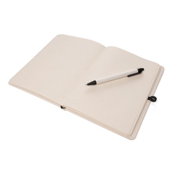 2-in-1 recycled milk carton A5 notebook set includes a matching ball pen made from recycled milk carton and ABS cap. Featuring 80 plain milk carton sheets with pen loop, ribbon and an elastic closure to keep your notes secure.