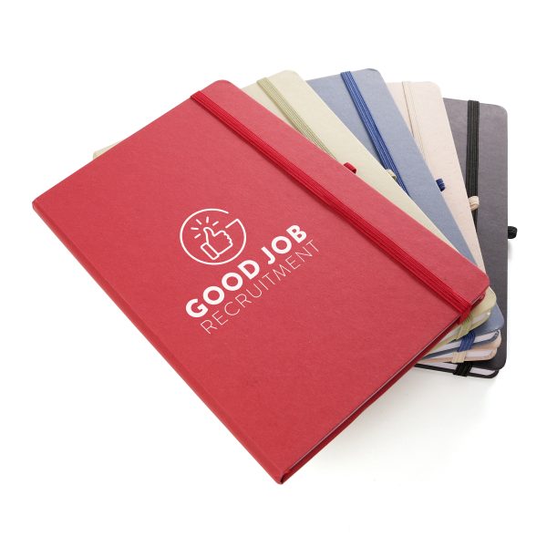 A5 notebook features a stylish fruit paper cover, recycled inner pages, recycled elastic closure, recycled ribbon and pen loop. It's compact and functional, with a variety of colours available to complement your branding.