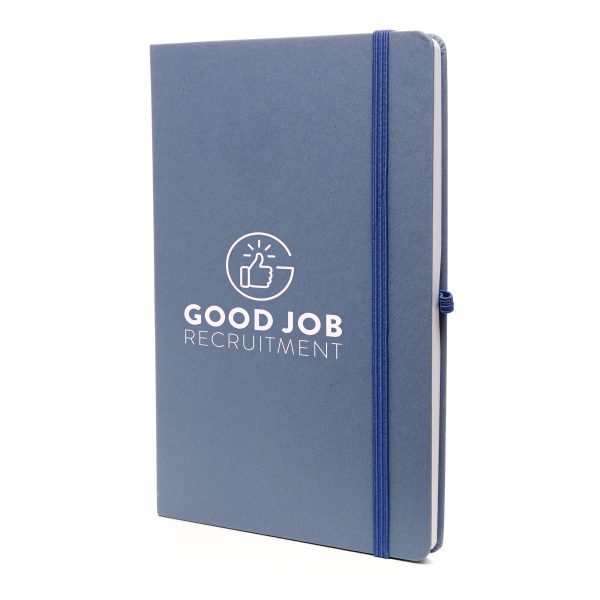 A5 notebook features a stylish fruit paper cover, recycled inner pages, recycled elastic closure, recycled ribbon and pen loop. It's compact and functional, with a variety of colours available to complement your branding.