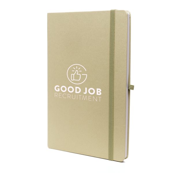 A5 notebook features a stylish fruit paper cover, recycled inner pages, recycled elastic closure, recycled ribbon and pen loop. It's compact and functional, with a variety of colours available to complement your branding.