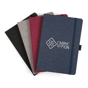 A5 RPET notebook featuring 80 sheets of wood pulp recycled lined paper with pre-printed recycled message, bookmark ribbon, pen loop and elastic closure to keep the pages secure.