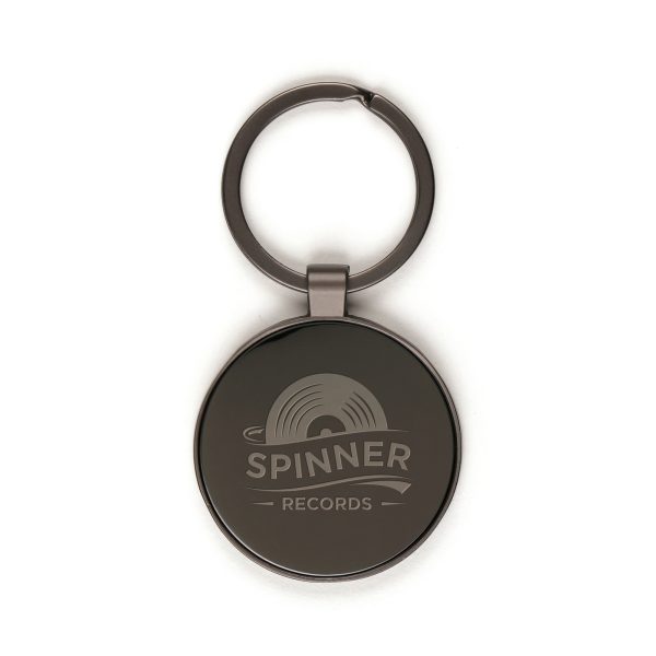 A sleek round keyring made from durable zinc alloy featuring an iron split ring and a metal plate for added strength. Finished in an elegant gun metal colour.