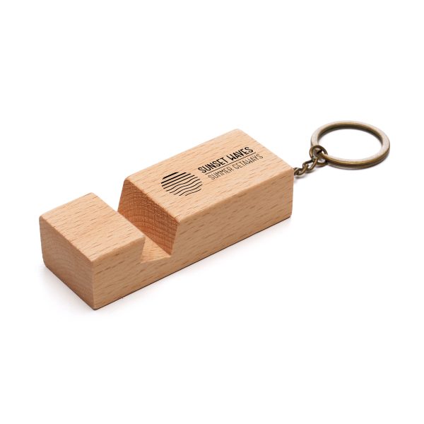 Introducing the stylish and durable Beech Wood Phone Stand Keyring - a practical and elegant promotional merchandise solution for keeping phones secure and easily accessible. Perfect for showcasing your brand in a sophisticated and functional way.