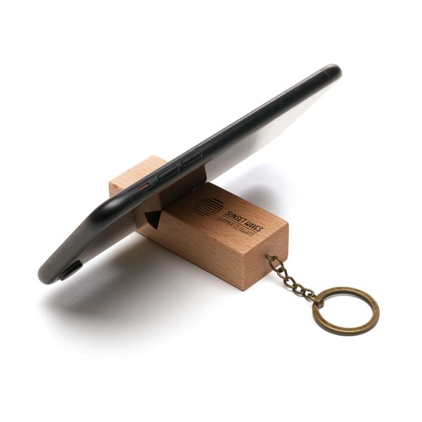 Introducing the stylish and durable Beech Wood Phone Stand Keyring - a practical and elegant promotional merchandise solution for keeping phones secure and easily accessible. Perfect for showcasing your brand in a sophisticated and functional way.