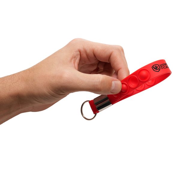 Our Fidget Popper Strap attaches easily to your phone case, letting you carry your phone on your wrist and stay hands-free. With a built-in fidget popper, it's perfect for stress relief and suited for busy lifestyles in retail, healthcare, and events.